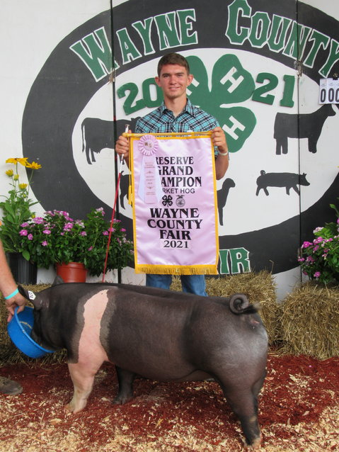Brady Hentschel and his 247-pound Reserve Grand Champion market hog.